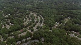 4.8K aerial stock footage flying over suburban homes and green trees in Fairfax, Virginia Aerial Stock Footage | AX74_012E