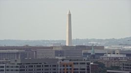 4.8K aerial stock footage of the Washington Monument seen from smoke stacks in Washington DC Aerial Stock Footage | AX74_060E