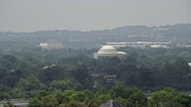 4.8K aerial stock footage of a view over trees of the Jefferson Memorial in Washington DC Aerial Stock Footage | AX74_063