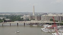 4.8K aerial stock footage approaching bridge, government office buildings, and Washington Monument in Washington DC Aerial Stock Footage | AX74_067E