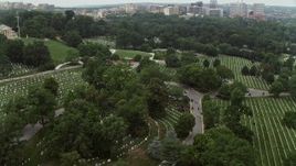 4.8K aerial stock footage flying by rows of grave stones at Arlington National Cemetery, Washington DC Aerial Stock Footage | AX74_114