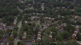 4.8K aerial stock footage tilting to a bird's eye view of row houses in Springfield, Virginia Aerial Stock Footage | AX74_134