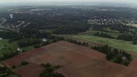 4.8K aerial stock footage flying over rural homes and farm fields around Prince William Parkway in Manassas, Virginia Aerial Stock Footage | AX74_148E