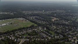 4.8K aerial stock footage flying by suburban neighborhoods. and fairground, Manassas, Virginia Aerial Stock Footage | AX75_001E