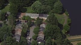 4.8K aerial stock footage of a bird's eye view of waterfront row houses in Burke, Virginia Aerial Stock Footage | AX75_019
