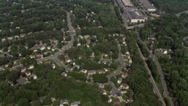 4.8K aerial stock footage of a bird's eye view of suburban neighborhoods and streets in Burke, Virginia Aerial Stock Footage | AX75_020E