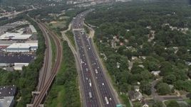 4.8K aerial stock footage tilt from heavy traffic on Interstate 95 to wider view of Alexandria, Virginia Aerial Stock Footage | AX75_031E