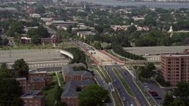 4.8K aerial stock footage flying by slow traffic on Interstate 95 near overpass and apartment buildings in Alexandria, Virginia Aerial Stock Footage | AX75_037E