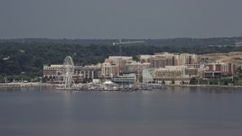4.8K aerial stock footage approaching marina and Capitol Wheel at National Harbor, Maryland Aerial Stock Footage | AX75_039