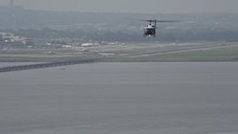 4.8K aerial stock footage of a helicopter flying over the Potomac River near Alexandria, Virginia Aerial Stock Footage | AX75_044