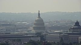 4.8K aerial stock footage of the United States Capitol and Thomas Jefferson Building domes in Washington DC Aerial Stock Footage | AX75_067E