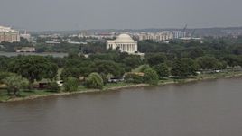 4.8K aerial stock footage of Jefferson Memorial seen from the Potomac River in Washington DC Aerial Stock Footage | AX75_080