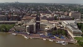 4.8K aerial stock footage approaching and tilting to the Washington Harbour in Georgetown, Washington DC Aerial Stock Footage | AX75_092
