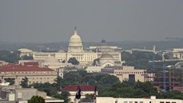 4.8K aerial stock footage of the United States Capitol and Smithsonian Museum domes seen from Potomac River in Washington DC Aerial Stock Footage | AX75_124