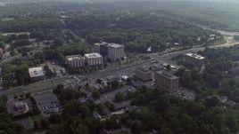 4.8K aerial stock footage of office buildings by a busy intersection in Annandale, Virginia Aerial Stock Footage | AX75_152
