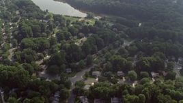 4.8K aerial stock footage of a bird's eye view of suburban homes near Lake Royal in Fairfax, Virginia Aerial Stock Footage | AX75_159E