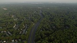 4.8K aerial stock footage flying by Fairfax County Parkway, suburban neighborhoods, Burke, Virginia, sunset Aerial Stock Footage | AX76_016