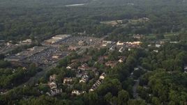 4.8K aerial stock footage flying by town houses near strip malls, Springfield, Virginia, sunset Aerial Stock Footage | AX76_019E