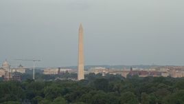 4.8K aerial stock footage of the Washington Monument, reveal the United States Institute of Peace, Washington D.C., sunset Aerial Stock Footage | AX76_052