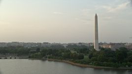 4.8K aerial stock footage of the Old Executive Office Building, The White House, and Washington Monument, Washington D.C., sunset Aerial Stock Footage | AX76_065