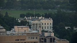 4.8K aerial stock footage flying by The White House, reveal North Lawn Fountain, Washington D.C., sunset Aerial Stock Footage | AX76_077