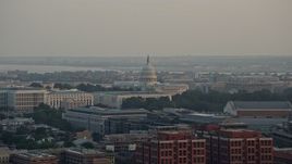4.8K aerial stock footage of the United States Capitol behind the Russell Senate Office Building, Washington D.C., sunset Aerial Stock Footage | AX76_086