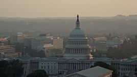4.8K aerial stock footage of the United States Capitol, revealing Washington Monument, Washington D.C., sunset Aerial Stock Footage | AX76_089