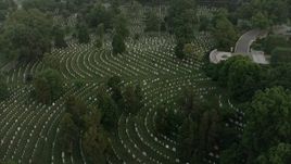 4.8K aerial stock footage flying over Arlington National Cemetery gravestones, Arlington, Virginia, twilight Aerial Stock Footage | AX76_119
