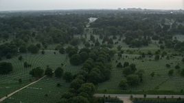 4.8K aerial stock footage flying by Arlington National Cemetery, Arlington, Virginia, twilight Aerial Stock Footage | AX76_126E