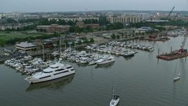 4.8K aerial stock footage of Yachts docked at Gangplank Marina, Washington, D.C., twilight Aerial Stock Footage | AX76_134