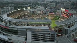 4.8K aerial stock footage flying by Nationals Park crowded with fans, Washington, D.C., twilight Aerial Stock Footage | AX76_139