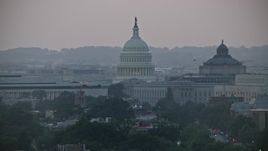 4.8K aerial stock footage of the United States Capitol dome between the James Madison and Thomas Jefferson Buildings in Washington, D.C., twilight Aerial Stock Footage | AX76_142