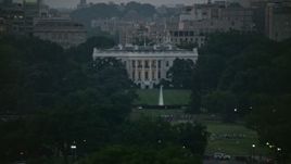 4.8K aerial stock footage of the White House, eclipsed by Washington Monument, Washington, D.C., twilight Aerial Stock Footage | AX76_150