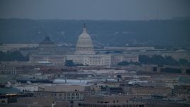 4.8K aerial stock footage of the Thomas Jefferson Building and United States Capitol seen from Georgetown, Washington, D.C., twilight Aerial Stock Footage | AX76_157