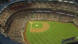 4.8K aerial stock footage flying by a baseball game at Nationals Park, Washington, D.C., twilight Aerial Stock Footage | AX76_172E