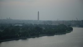 4.8K aerial stock footage of the Washington Monument seen from East Potomac Park in Washington, D.C., twilight Aerial Stock Footage | AX76_176