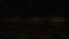 4.8K aerial stock footage of a bird's eye view of light traffic on Interstate 95, Alexandria, Virginia, night Aerial Stock Footage | AX77_003E