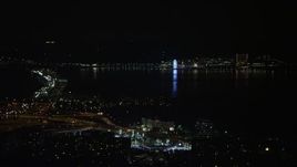 4.8K aerial stock footage of the Capitol Wheel and Gaylord National Resort & Convention Center across the Potomac, National Harbor, Maryland, night Aerial Stock Footage | AX77_008