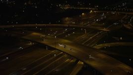 4.8K aerial stock footage panning across Interstate 95 to reveal Woodrow Wilson Memorial Bridge, Fort Washington, Maryland, night Aerial Stock Footage | AX77_010