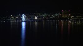 4.8K aerial stock footage of Capitol Wheel and Gaylord National Resort and Convention Center, National Harbor, Maryland, night Aerial Stock Footage | AX77_011