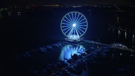 4.8K aerial stock footage of the Capitol Wheel and the National Harbor Marina, Maryland, night Aerial Stock Footage | AX77_018
