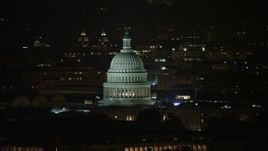 4.8K aerial stock footage of the United States Capitol and Thomas Jefferson Building domes in Washington, D.C., night Aerial Stock Footage | AX77_030E
