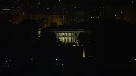 4.8K aerial stock footage of The White House, eclipsed by Washington Monument, Washington, D.C., night Aerial Stock Footage | AX77_040
