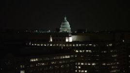 4.8K aerial stock footage of the United States Capitol dome and office buildings in Washington, D.C., night Aerial Stock Footage | AX77_046