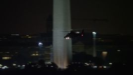 4.8K aerial stock footage tracking a helicopter flying over National Mall, Washington, D.C., night Aerial Stock Footage | AX77_055