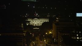 4.8K aerial stock footage of The White House, tilt to reveal Washington Monument and Jefferson Memorial, Washington, D.C., night Aerial Stock Footage | AX77_065