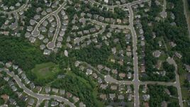 4.8K aerial stock footage of a bird's eye view of suburban homes, roads, trees, Clifton, Virginia Aerial Stock Footage | AX78_016E
