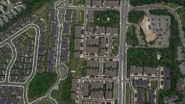 4.8K aerial stock footage of a bird's eye view of suburban neighborhoods, Greenbriar East Elementary School, Highway 50, Fairfax, Virginia Aerial Stock Footage | AX78_021E
