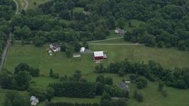 4.8K aerial stock footage approaching a red barn and rural home in Brookeville, Maryland Aerial Stock Footage | AX78_052E