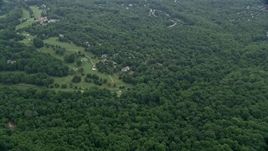 4.8K aerial stock footage flying over forest to approach Hobbit's Glen Golf Course in Columbia, Maryland Aerial Stock Footage | AX78_063E